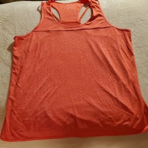 Orange tek gear workout shirt.